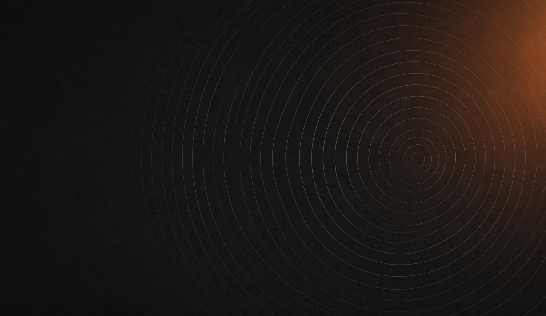 Abstract dark background with concentric ring patterns representing brand evolution and transformation